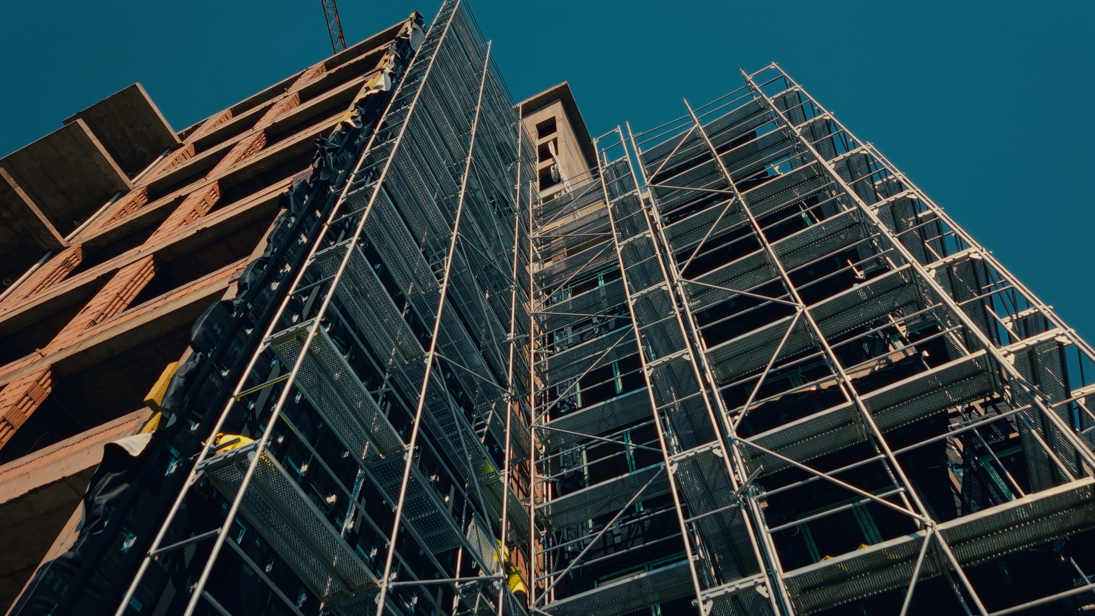 Facade installation and scaffolding on a Greenwall construction site